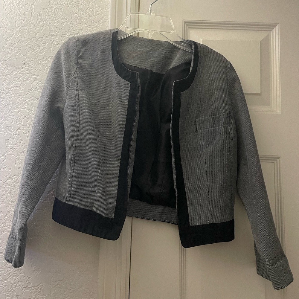 Cropped gray/black jacket.